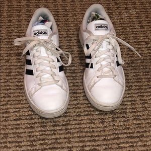 worn black and white superstar adidas